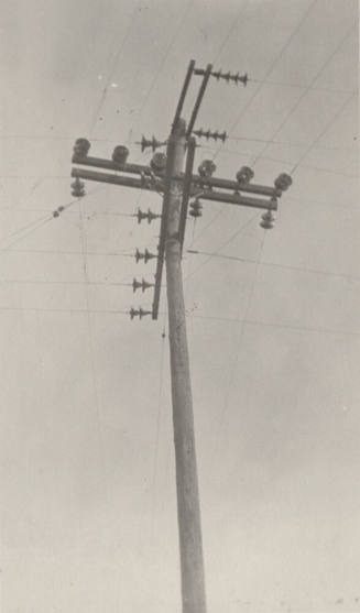 Photo- power pole with crossbars and insulators