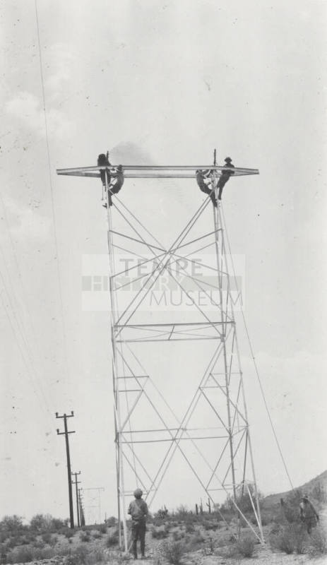 Photo- construction crew erecting a line tower
