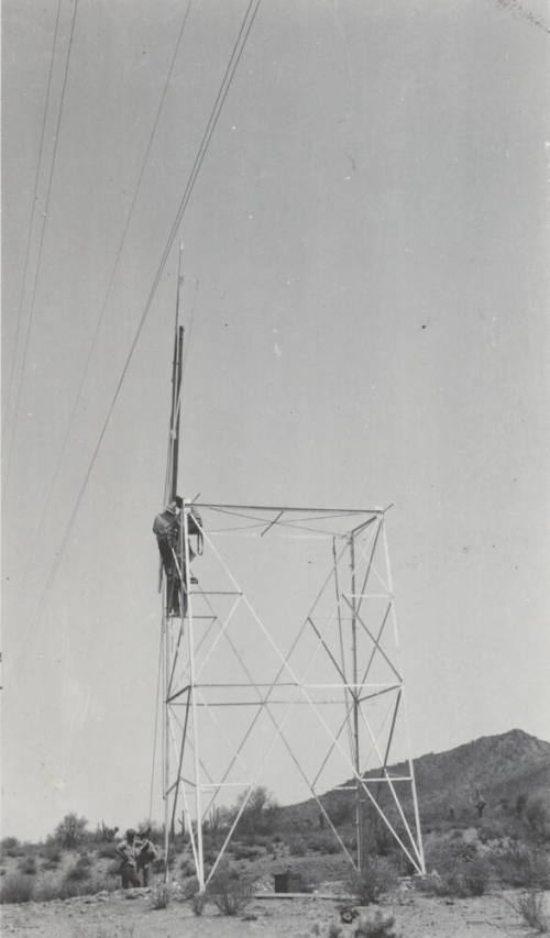 Photo- construction crew erecting a line tower