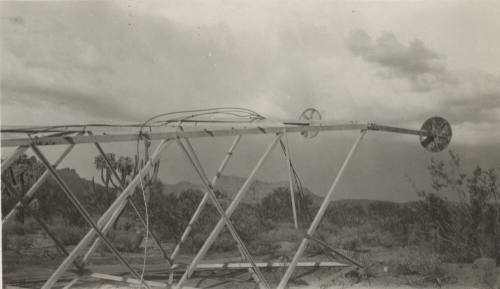 Line Tower lying on its side on desert floor