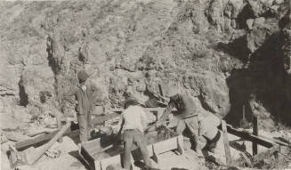 Workers pouring cement footers for Horse-Mesa Line