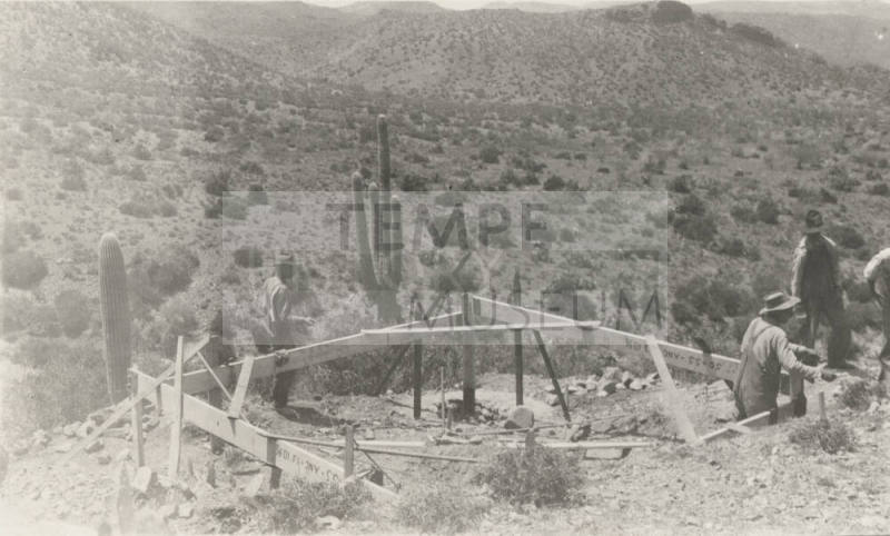Workers building tower base