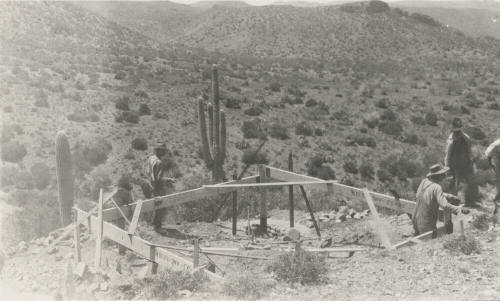 Workers building tower base