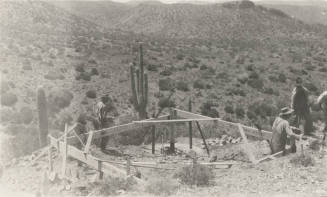 Workers building tower base
