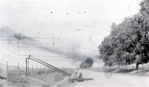 Photo-Two men repairing downed power lines