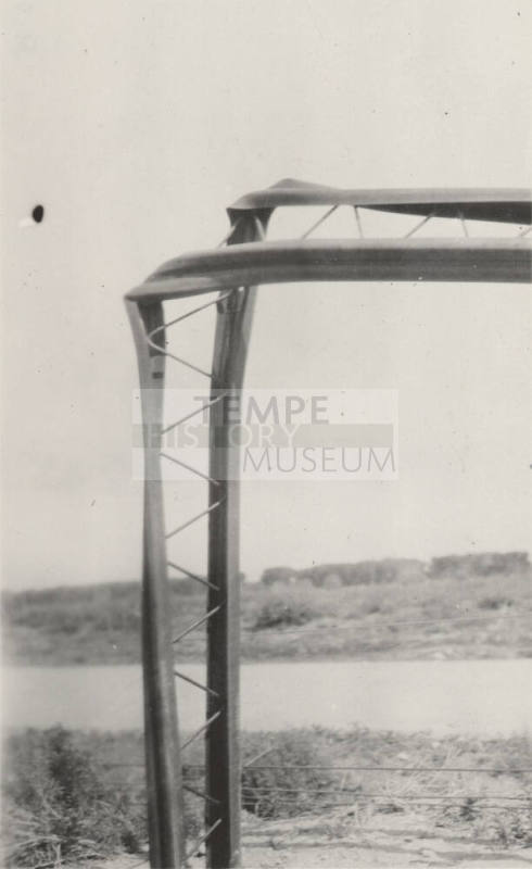 Photo-Closeup of bent power line poles