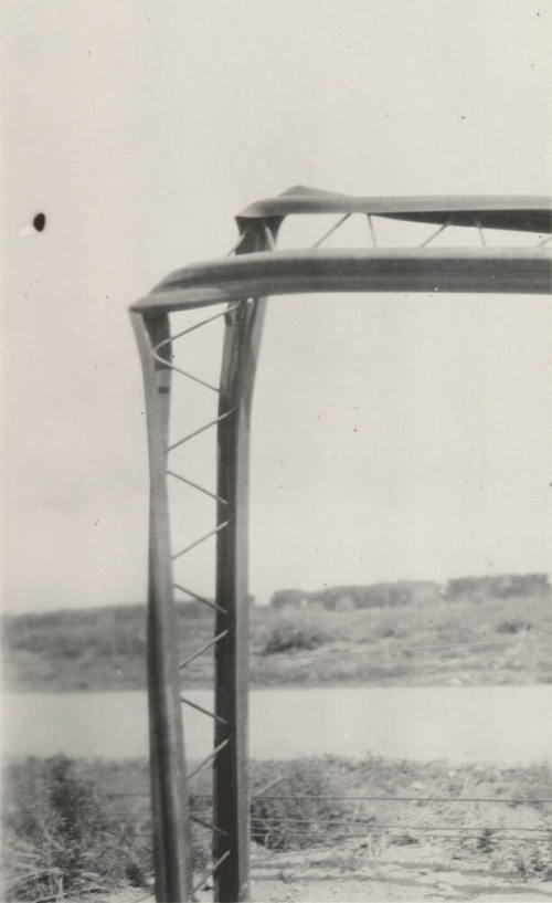 Photo-Closeup of bent power line poles
