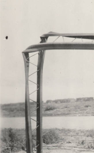 Photo-Closeup of bent power line poles