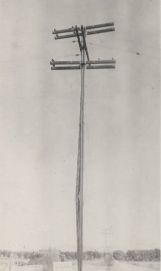 Photo-View of power line poles with bent pole