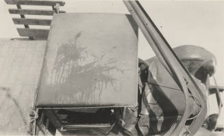 Photo-View of overturned truck and bent power poles