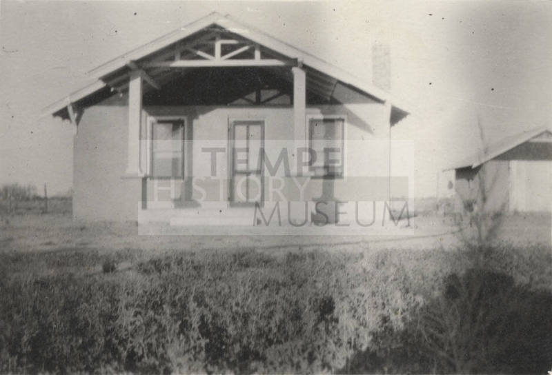 Photo-View of a house and garage