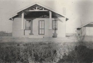 Photo-View of a house and garage