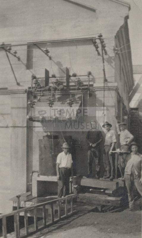 Photo- View of several workers standing near Arizona Falls Power  Plant