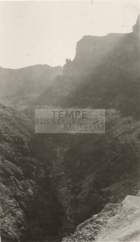 Photo- View of a river bed and canyon gorge cutting through mountains