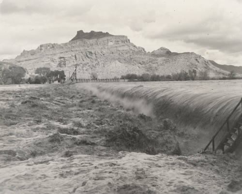 Photo- View of fast water flowing over Granite Reef Diversion Dam