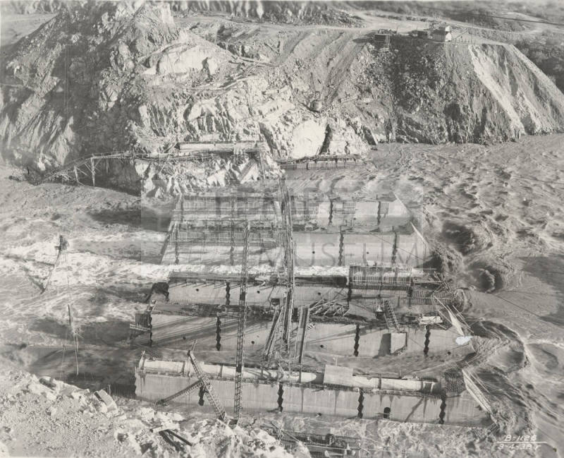 Photo-View of a flooded Verde River showing partial construction of Bartlett Dam