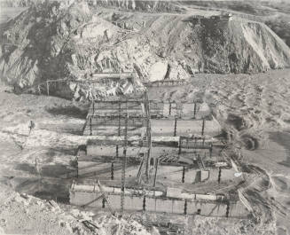 Photo-View of a flooded Verde River showing partial construction of Bartlett Dam
