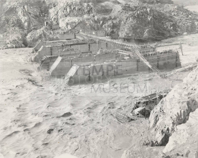 Photo-View of a flooded Verde River showing partial construction of Bartlett Dam