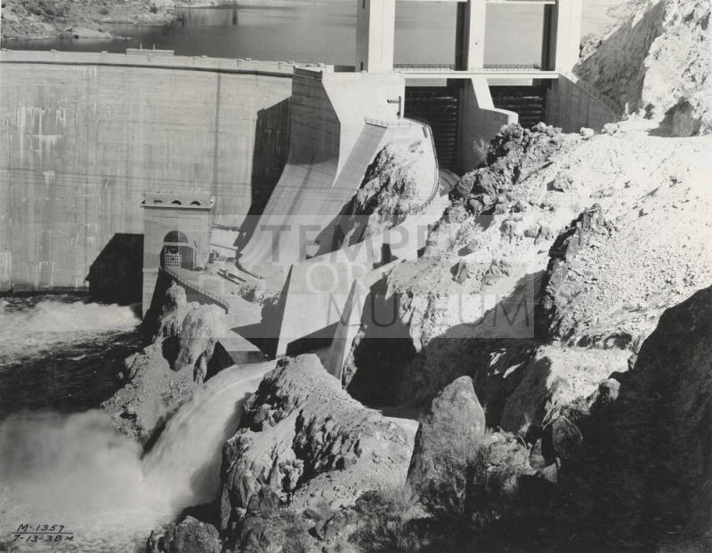 Photo- View of Morman Flat Dam with one gate open 12" for water release