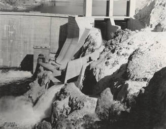 Photo- View of Morman Flat Dam with one gate open 12" for water release