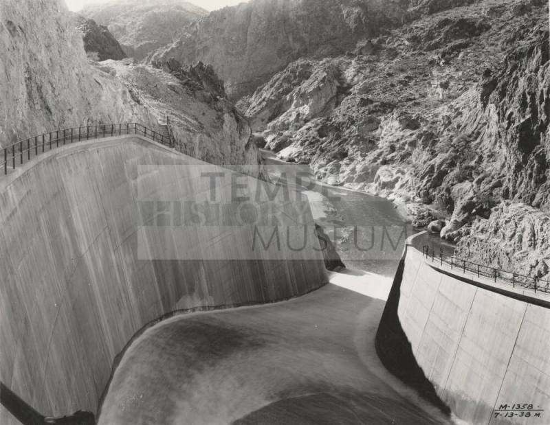 Photo- View of Morman Flat Dam with one gate open 12" for water release