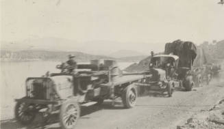 Photo-View of trucks hauling the number seven ( #7 )  generator to Roosevelt Dam