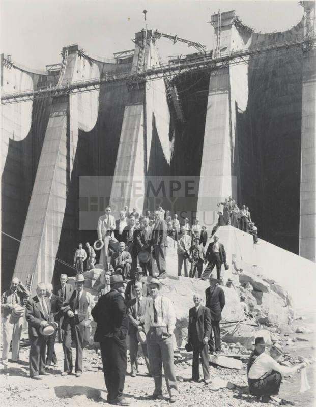 Photo- View of a large group of people standing at the base of Bartlett Dam