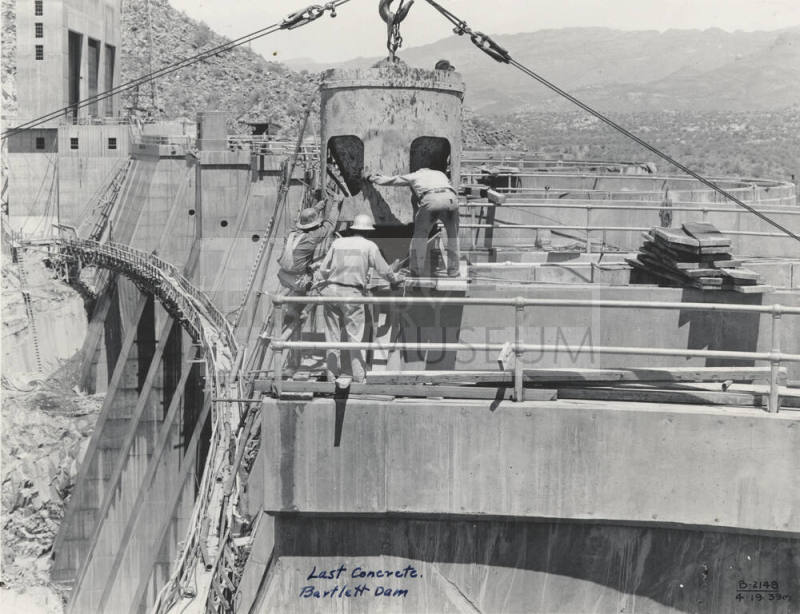 Photo- View of workers finishing the last concrete pour on Bartlett Dam