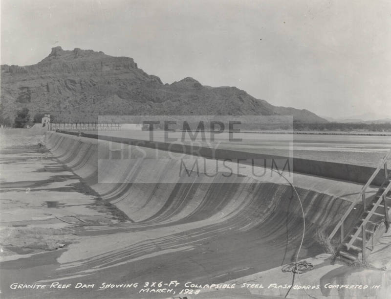 Photo-View of water flowing over steel flashboards at Granite Reef Diversion Dam