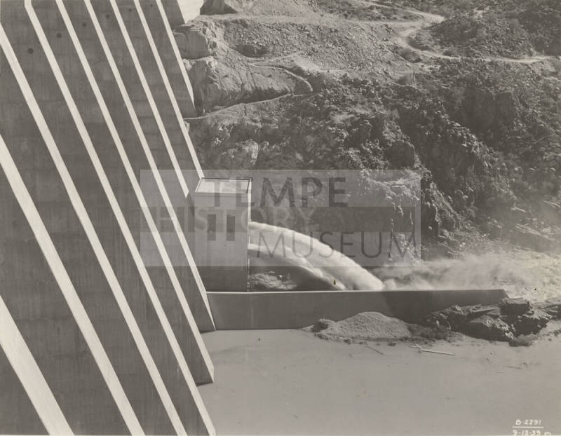 Photo- View of water running through needle valve outlet at Bartlett Dam