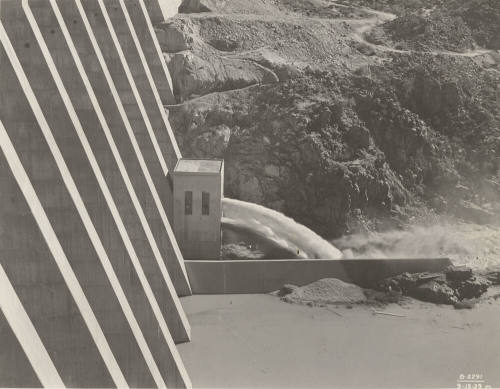 Photo- View of water running through needle valve outlet at Bartlett Dam