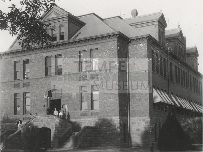 The Geology class of Frederick M. Irish stand on west stairway of  Old Main