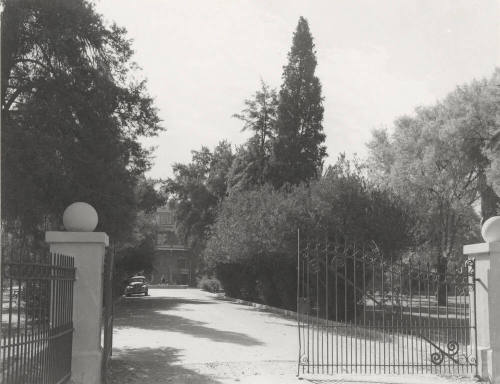 The north gate and drive to Old Main building