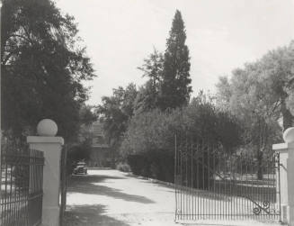 The north gate and drive to Old Main building