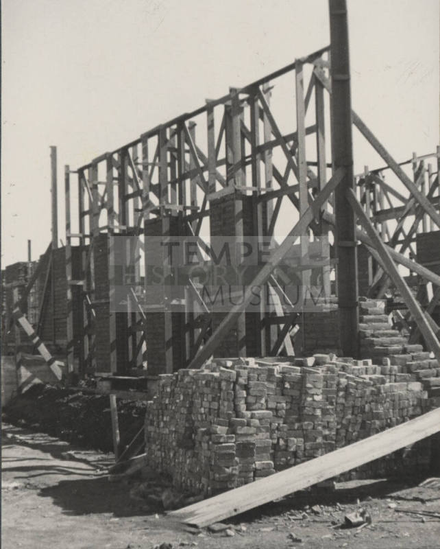 Brick stacked in front of wall under construction of B.B. Moeur Activity Building