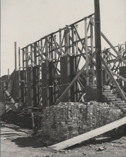 Brick stacked in front of wall under construction of B.B. Moeur Activity Building
