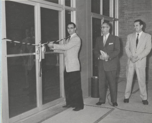 Dale Clarkson, ASASC President, cuts ribbon to north entrance of Memorial Union