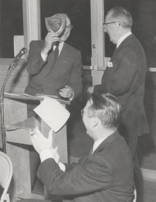 Charles A. Stauffer is applauded by President Gammage on behalf of fund drive