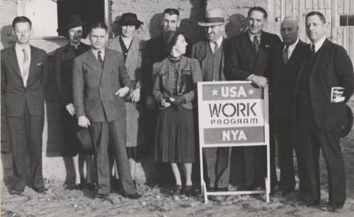 WPA staff members stand in front of B.B. Moeur Activity Building at ASU (still under construction)