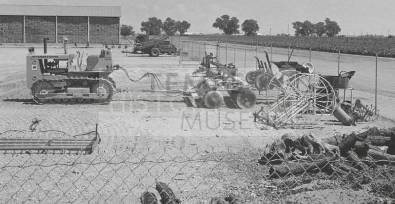 Caterpillar tractor and harrow at College Farm