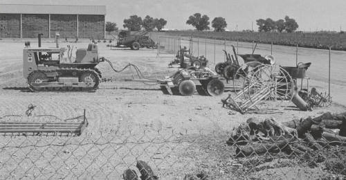 Caterpillar tractor and harrow at College Farm