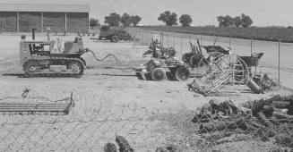 Caterpillar tractor and harrow at College Farm