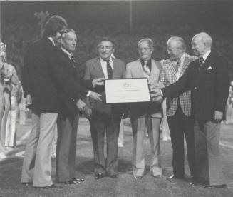 President John Schwada receives plaque for Arizona State University bicentennial