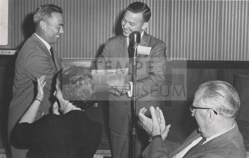 Alumni V.P. Wayne Legg greets Jim Creasman at Testimonial Dinner