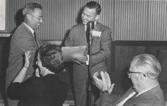 Alumni V.P. Wayne Legg greets Jim Creasman at Testimonial Dinner