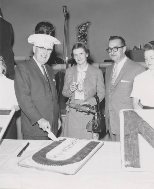 Dr. and Mrs. Gammage cutting ceremonial cake
