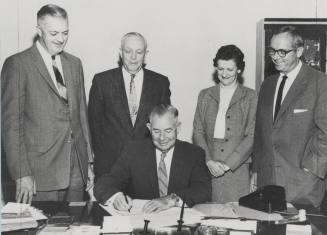 Governor Ernest Mcfarland and others sign canvas of votes on December 5, 1958