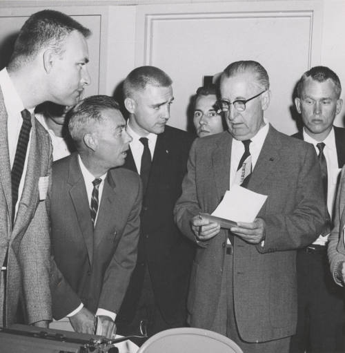 Name-change leaders hear a report that the name change was losing