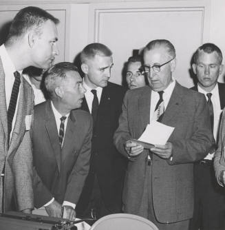 Name-change leaders hear a report that the name change was losing