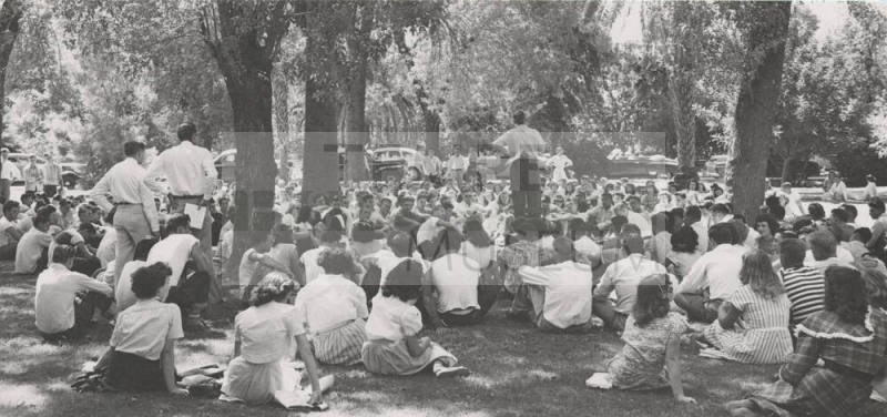 Vice-President H.D. Richardson Greets the Freshman Assembly Held Under the Trees